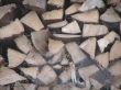 Wooden pile with spiderwebs