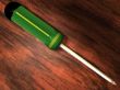 Green screwdriver on table