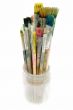 Used Paintbrushes in a Glass