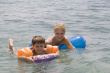 Smiling Boy and mom swimming in the ocean