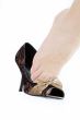 female`s foot jumping from shoe