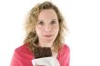 Young blond woman eats chocolate