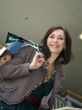The young beautiful woman with purchases in stor