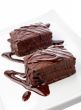 Two chocolate cupcakes on white plate