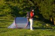 Girl with the backpack next to her tent