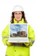 Showing a building construction on the laptop