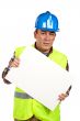 Construction worker holding the blank poster
