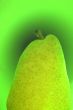 Green pear on a green background