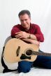 Man in 50`s playing guitar