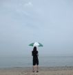Girl, Umbrella and Hazy Beach