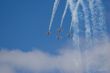 four planes in formation with vapour trails