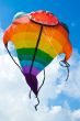 big colorful fish kite fly in blue summer sky