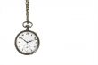 Old pocket watch hanging on white with text space