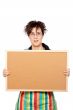 Housewife holding the empty corkboard