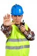 Construction worker talking with a walkie talkie