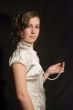 The girl holds pearls