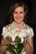A smiling girl with lilies