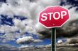 Stop sign with cloud background