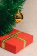 Gift box, ball and tinsel