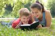 Mum and the son reads the book
