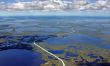 The Road through marsh on oilfield.