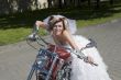 Bride and groom on a motorcycle
