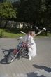 Bride and groom on a motorcycle
