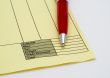 Blank invoice with pen