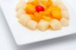 Fresh fruit salad on the white plate