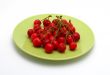 Cherries on the green plate
