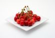 Cherries on the white plate