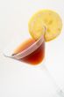 Detail of red cocktail with lemon