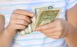 Child counting money (Shallow DOF)