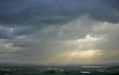 The sunrays and clouds.