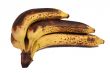 Hand of overripe bananas