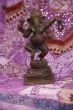 Bronze Ganesha dancing, on purple