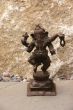 Bronze Ganesha dancing, on granite