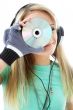 urban teenage girl in headphones holding cd