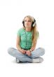 teenage girl in headphones sitting on the floor