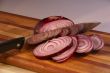 Sliced red onion and knife