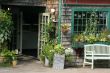 Shopfront with flowers in hanging pots
