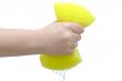 Hand squeezing drip out of sponge