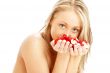 lovely blond in spa with red and white rose petals