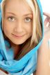 portrait of smiling blond in blue scarf