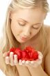 lovely blond in spa with red rose petals