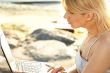 outdoor picture of blond with laptop