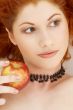 lovely redhead with delicious apple