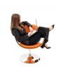 elegant businesswoman with laptop in orange chair