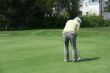 Woman golfer on putting green