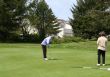 Woman golfer on putting green